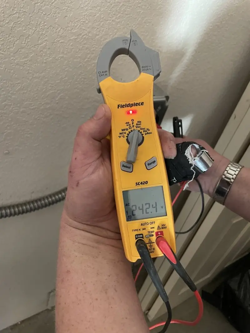 Voltage testing with clamp meter during Generator Installation in Elkins